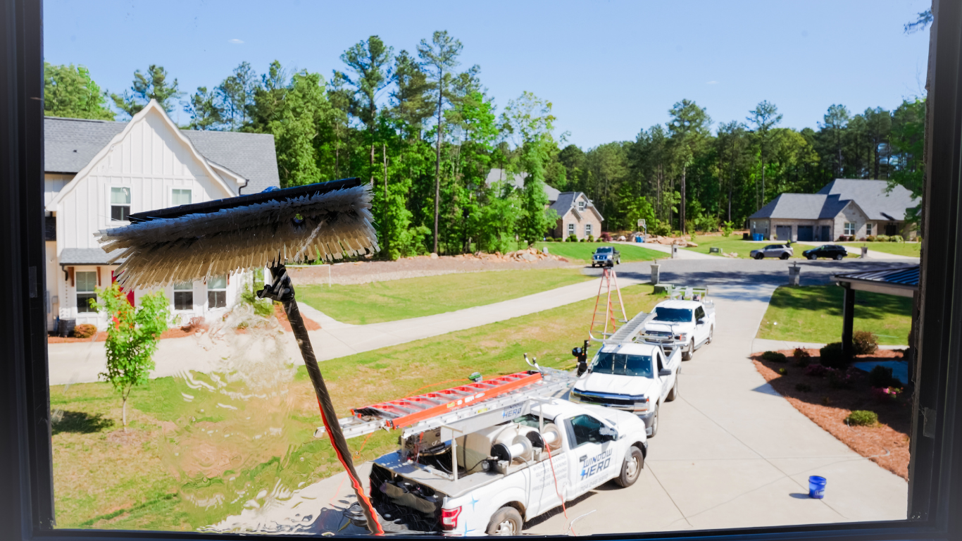 Window Hero trucks on site in a neighborhood