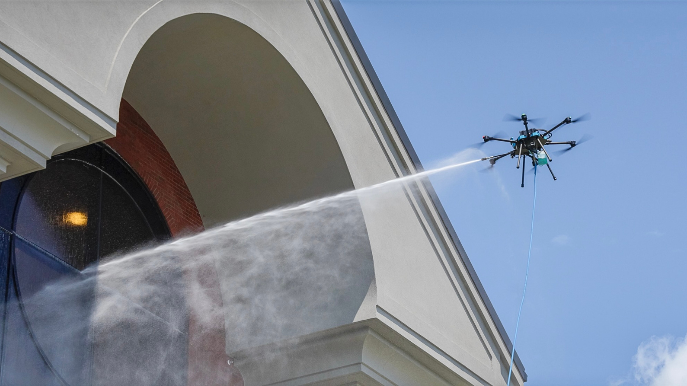Window Hero drone cleaning exterior of school.
